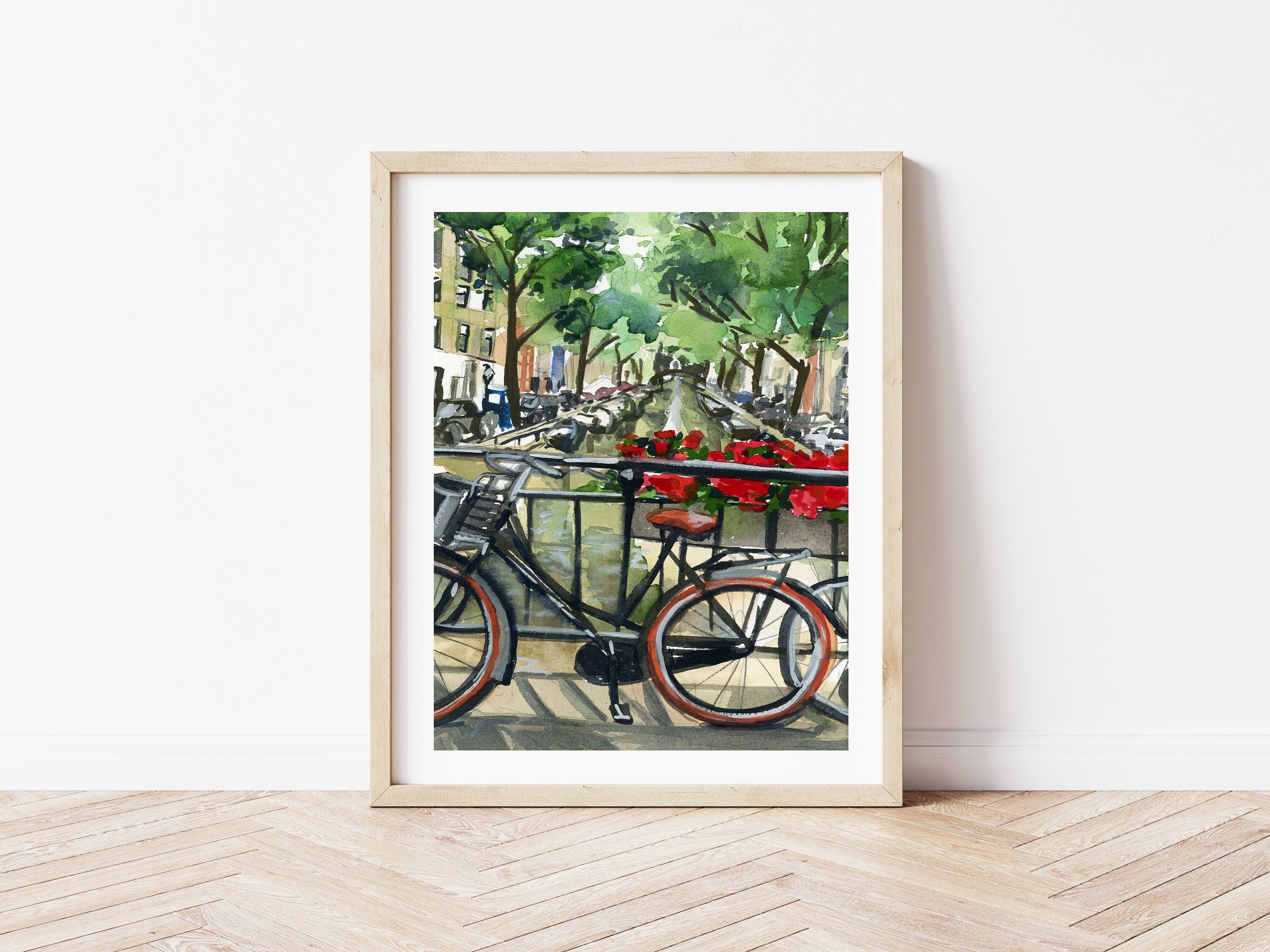 Bike on Amsterdam canal print of painting by Medjool Studio. Print of original gouache painting featuring a close up of a bike on a bridge that has red flowers along the railing looking over the Amsterdam canal.