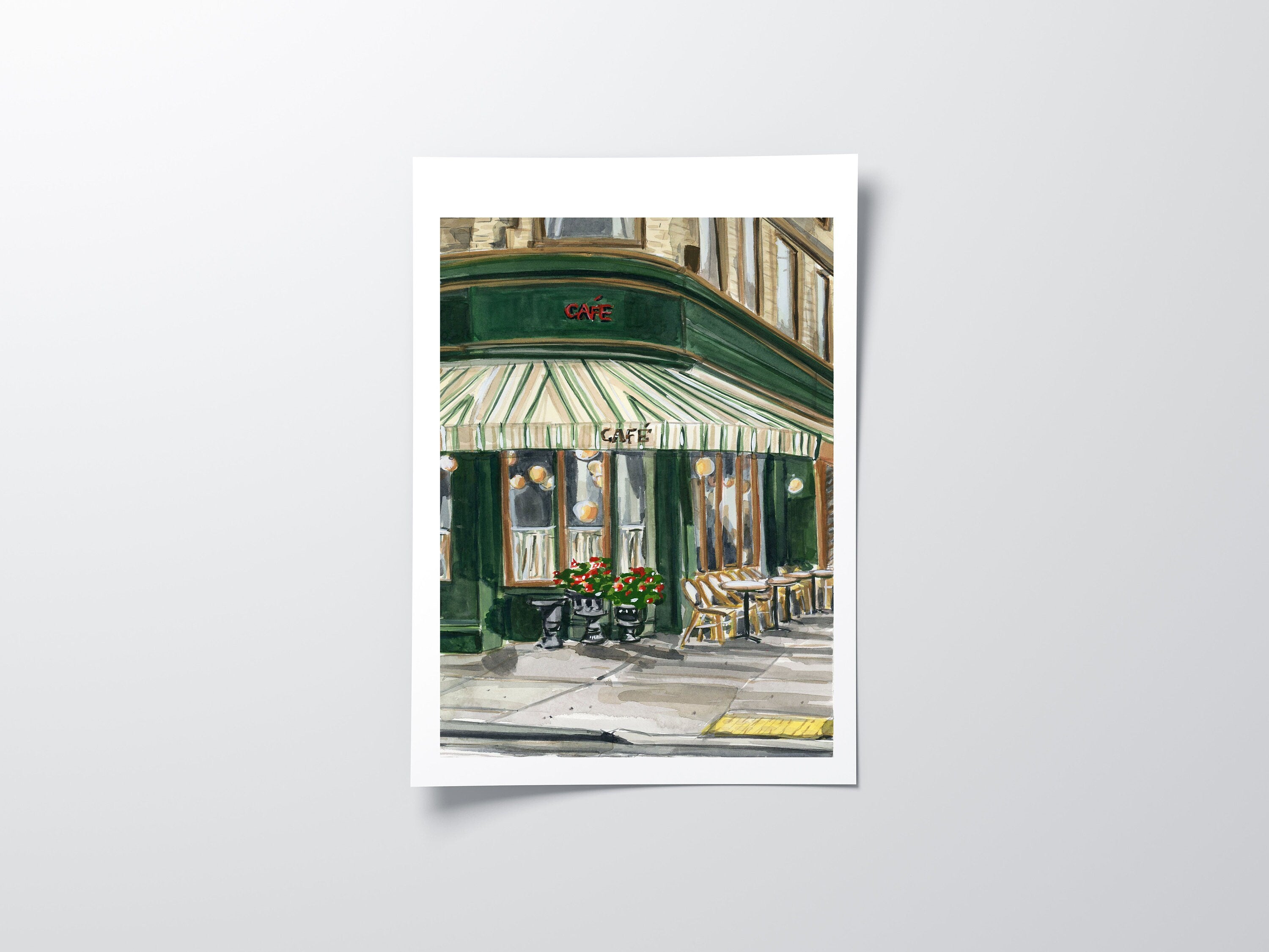 French cafe print of painting by Medjool Studio. Print of original gouache painting of the front of a small cafe on the corner of a street in France. Inspired by travels to Europe and fond memories of sightseeing and stopping for a coffee and croissant to refresh and enjoy the French atmosphere.