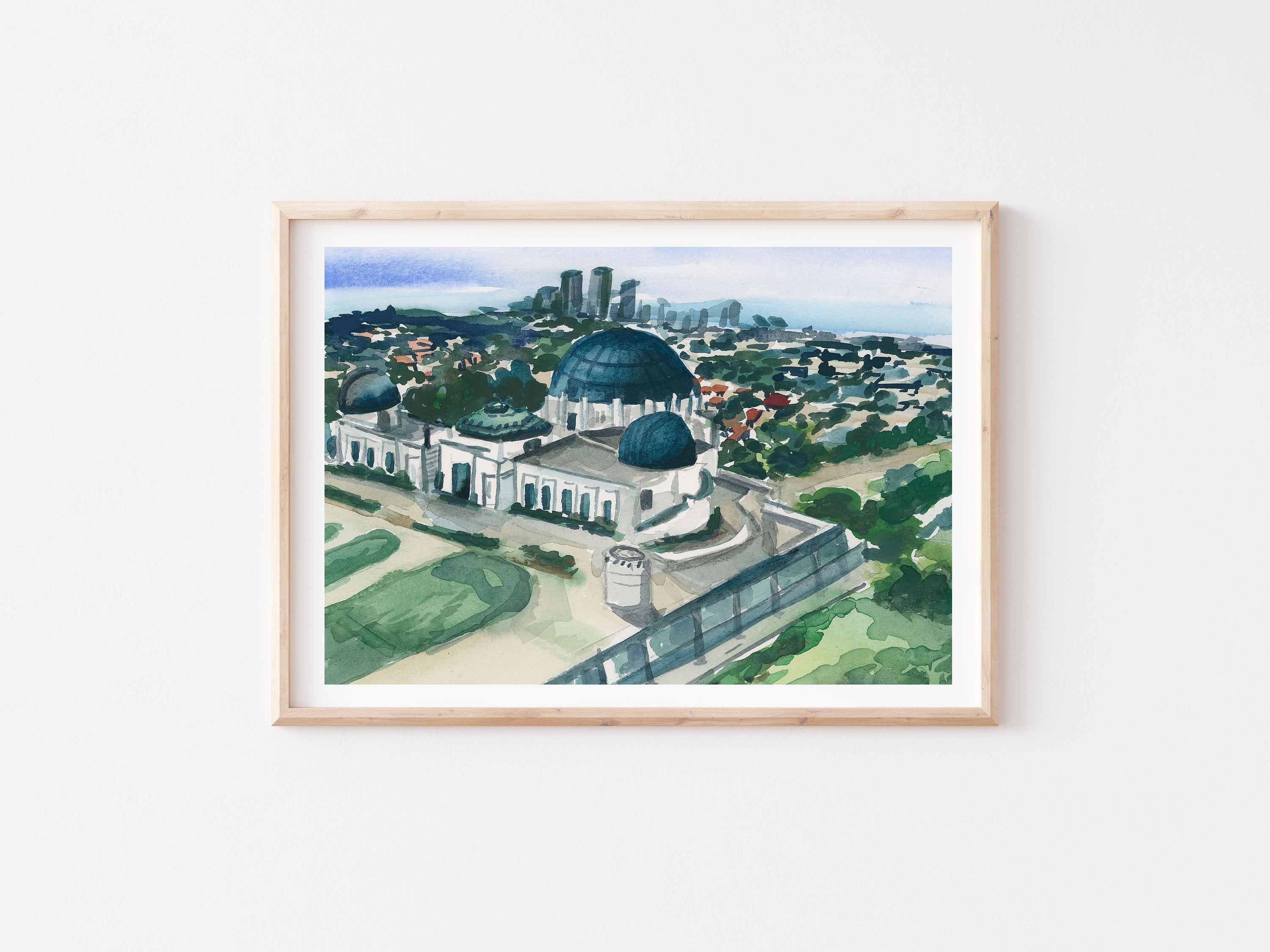 Griffith observatory print of painting by Medjool Studio. Print of a watercolor of the Griffith Observatory Park in the Hollywood Hills. This Los Angeles poster combines the downtown in the distance with the green space that the park offers.