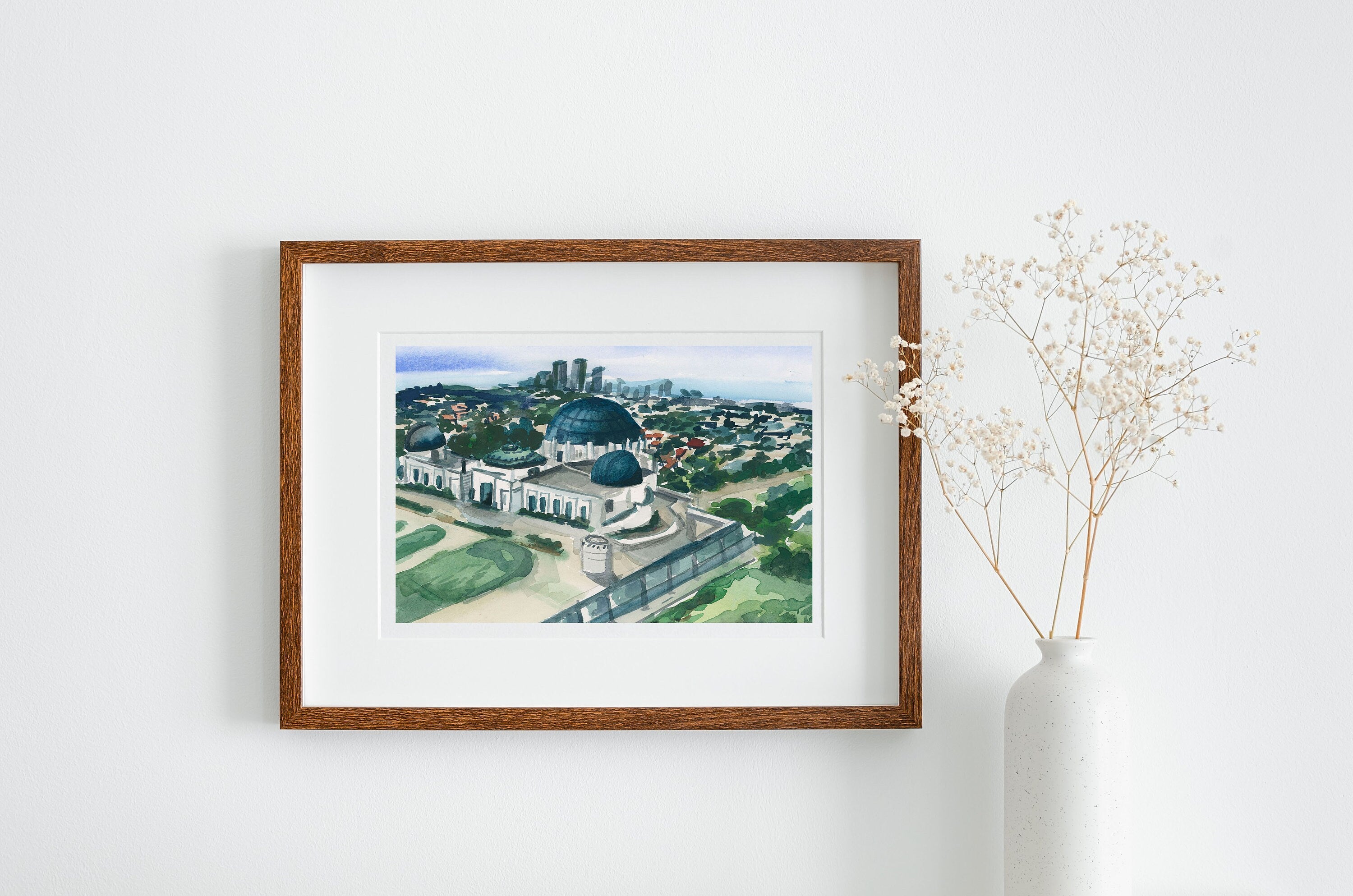 Griffith observatory print of painting by Medjool Studio. Print of a watercolor of the Griffith Observatory Park in the Hollywood Hills. This Los Angeles poster combines the downtown in the distance with the green space that the park offers.