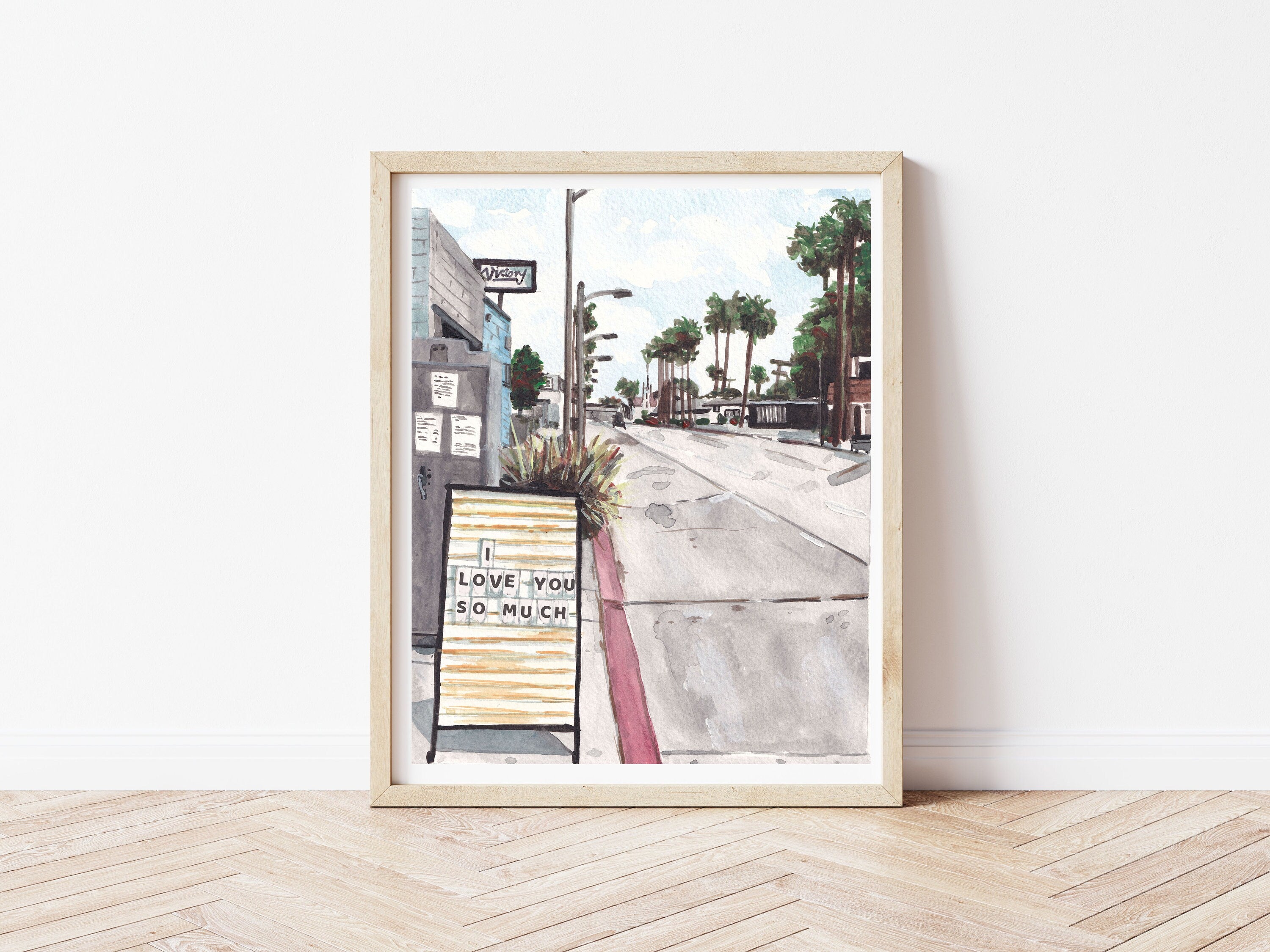 Los Angeles Streetscape - I Love You Sign print of painting by Medjool Studio. Print of original gouache painting of a Los Angeles streetscape, with palm trees, iconic buildings and an "I Love You" sign. 
