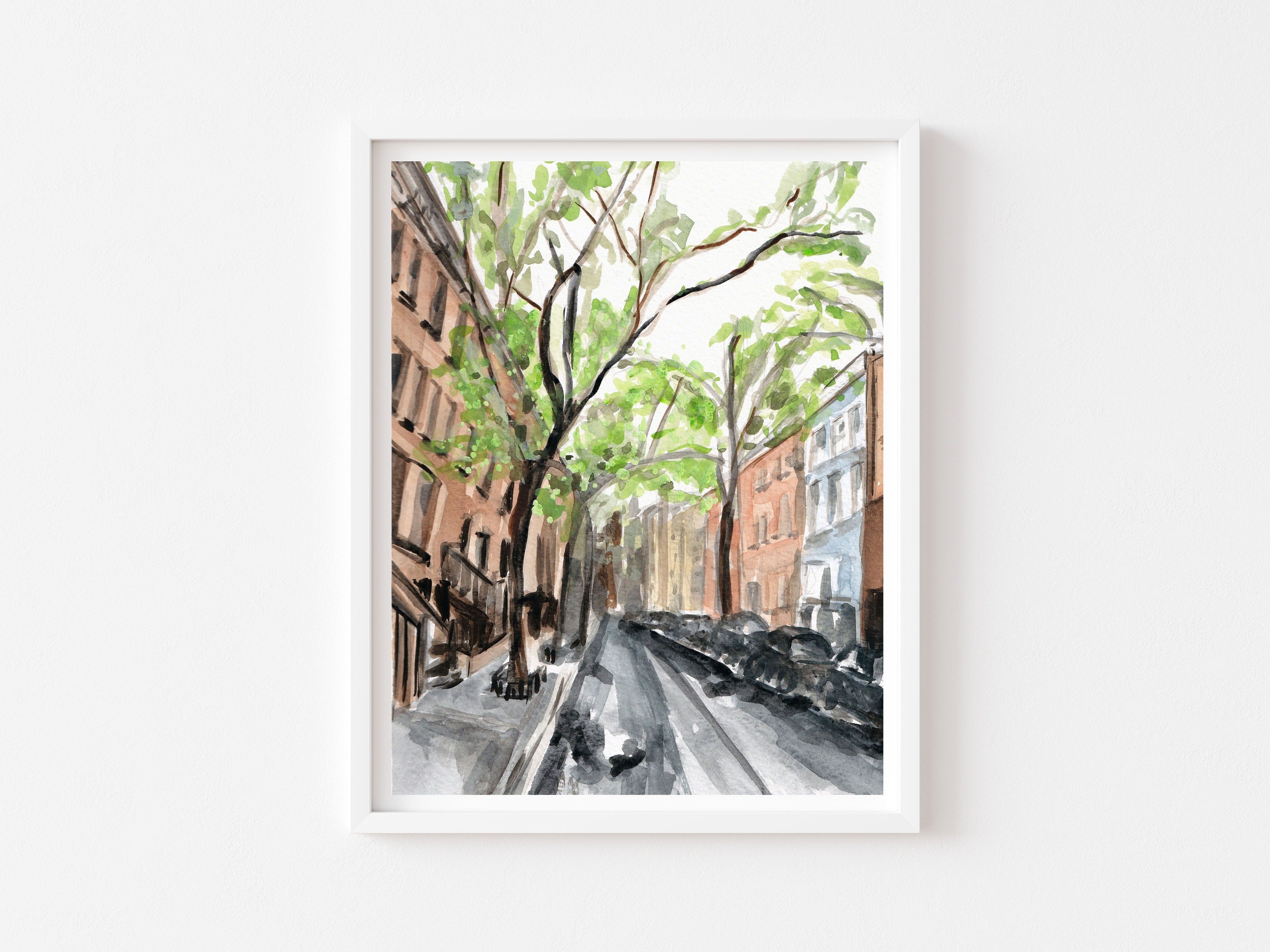 New York city streetscape print of painting by Medjool Studio. Print of original gouache painting that is a slightly abstract interpretation of the classic architecture. Shows a scene looking down a street with tall buildings, cars and trees along the sides of the street.