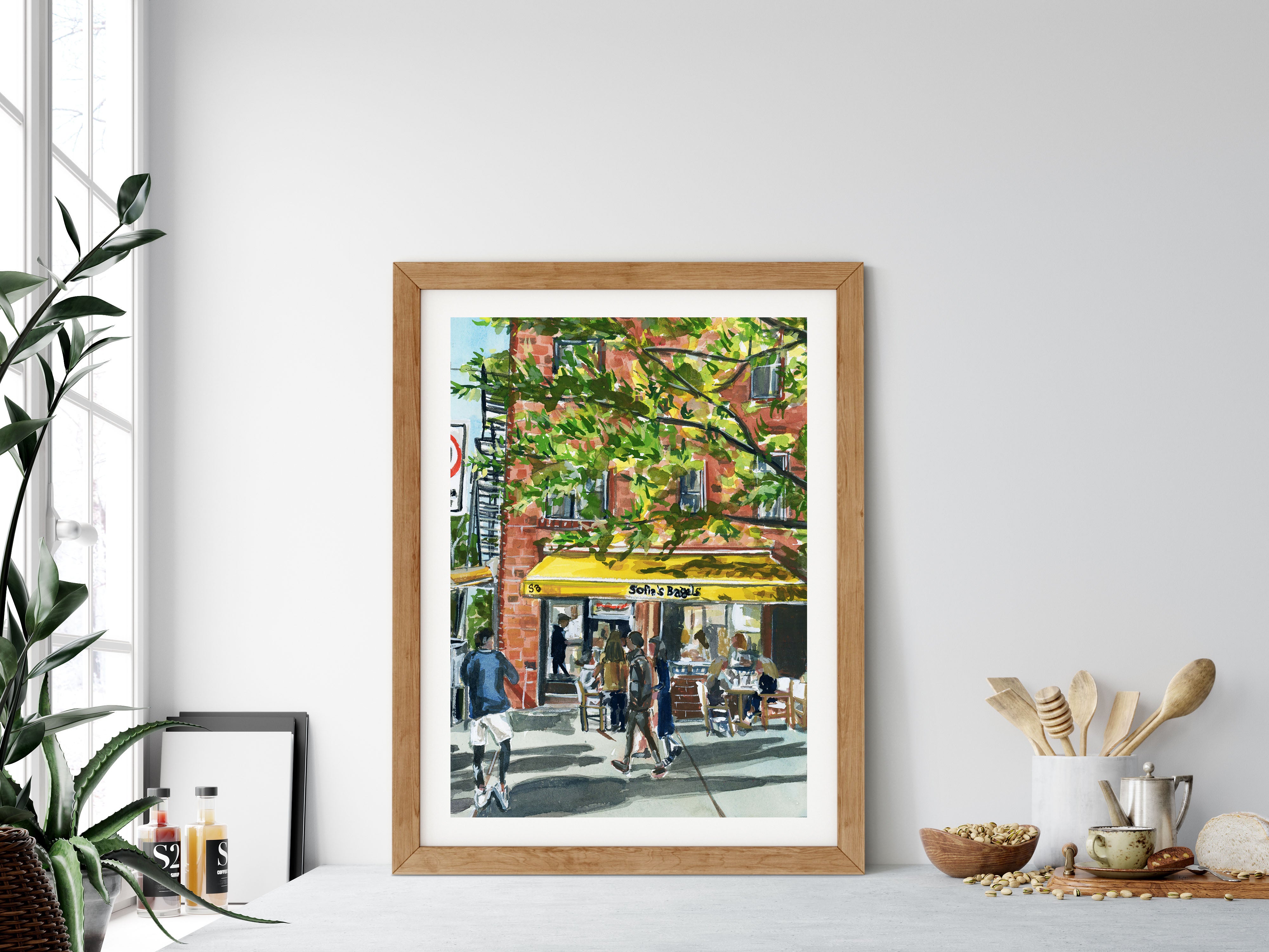 Sofia’s Bagels print of painting by Medjool Studio. Print of original gouache painting of Sofia's Bagel Cafe in Greenwich Village, NYC, captured in a serene morning scene using soft hues and delicate brush strokes.