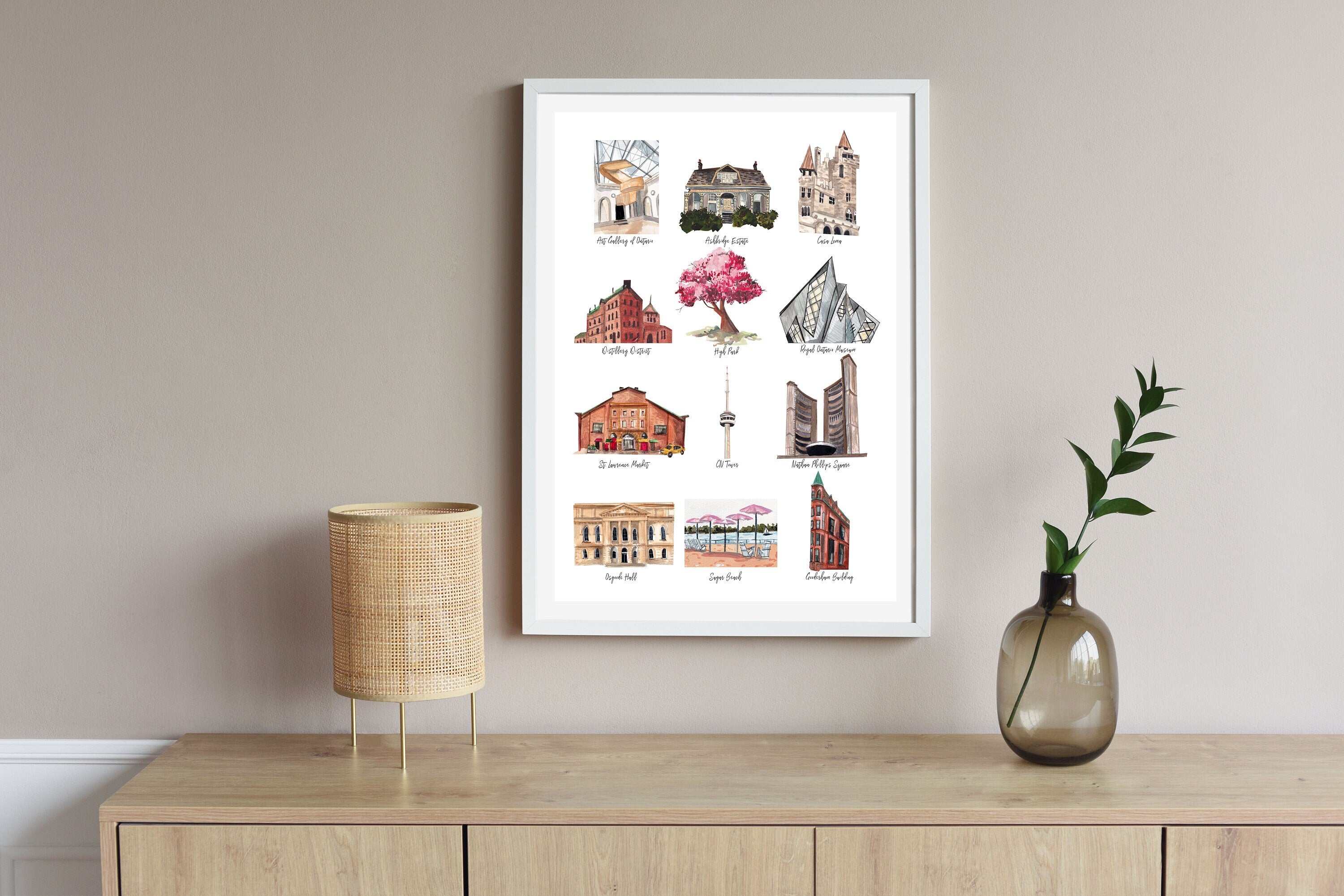 Toronto landmarks print of painting by Medjool Studio. Print of an original gouache painting of 12 notable landmarks in Toronto, Canada, including the Art Gallery of Ontario, High Park, the Distillery District, Casa Loma, the Royal Ontario Museum, St. Lawrence Market, the CN Tower, and more!