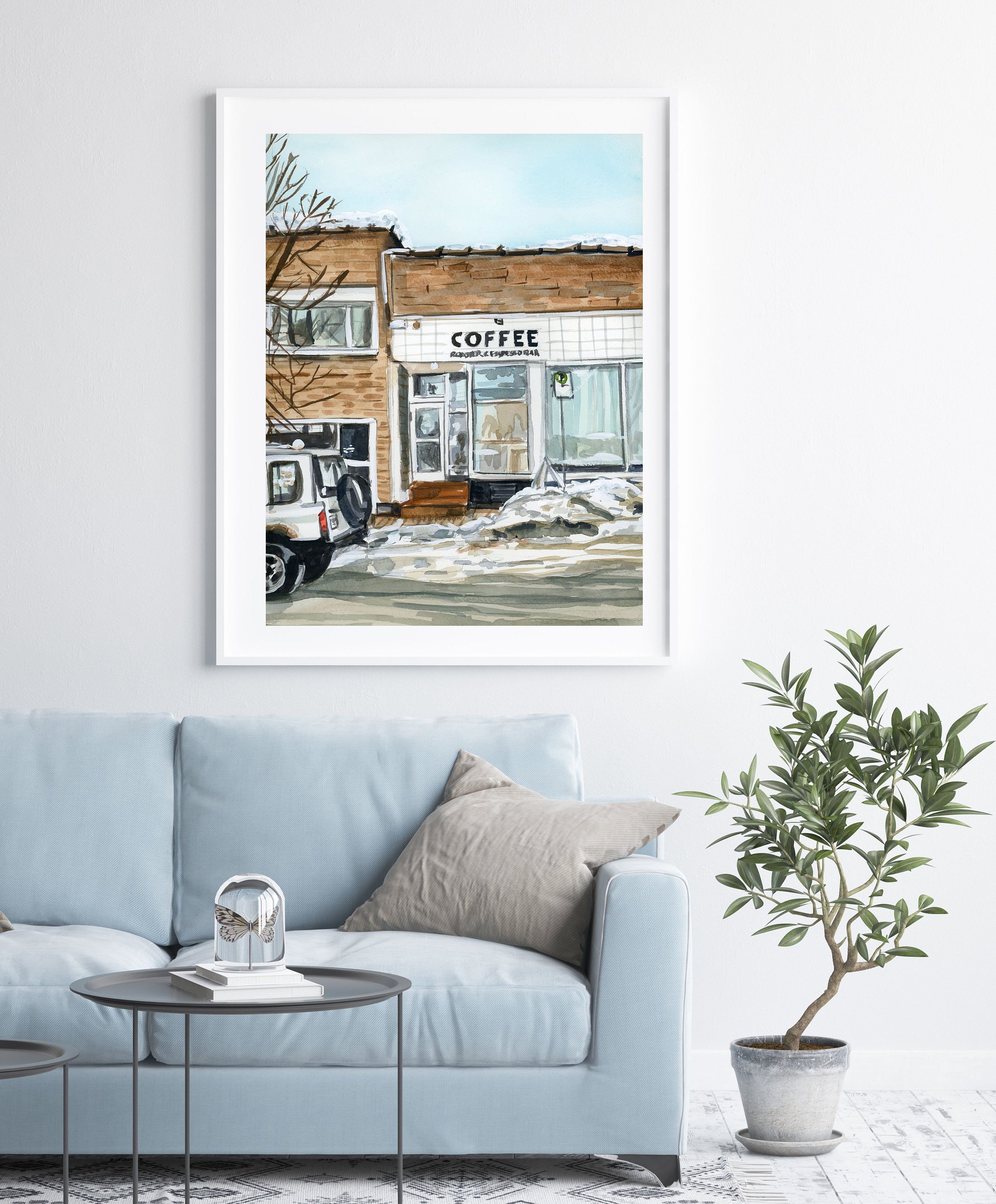 Winter coffee shop print of painting by Medjool Studio. Print of an original gouache painting that captures the charming essence of the mountain town of Kimberly, British Columbia featuring the iconic Kick Turn Coffee Shop.