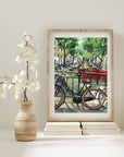 Bike on Amsterdam canal print of painting by Medjool Studio. Print of original gouache painting featuring a close up of a bike on a bridge that has red flowers along the railing looking over the Amsterdam canal.