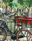 Bike on Amsterdam canal print of painting by Medjool Studio. Print of original gouache painting featuring a close up of a bike on a bridge that has red flowers along the railing looking over the Amsterdam canal.