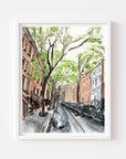 New York city streetscape print of painting by Medjool Studio. Print of original gouache painting that is a slightly abstract interpretation of the classic architecture. Shows a scene looking down a street with tall buildings, cars and trees along the sides of the street.