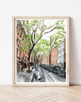 New York city streetscape print of painting by Medjool Studio. Print of original gouache painting that is a slightly abstract interpretation of the classic architecture. Shows a scene looking down a street with tall buildings, cars and trees along the sides of the street.